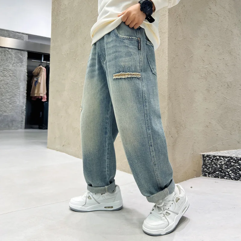 جديد ربيع وخريف 2025 بنطال جينز رائع للأولاد سروال كوري فضفاض أزرق غير رسمي مطبوع ملابس أطفال 5-14 سنة