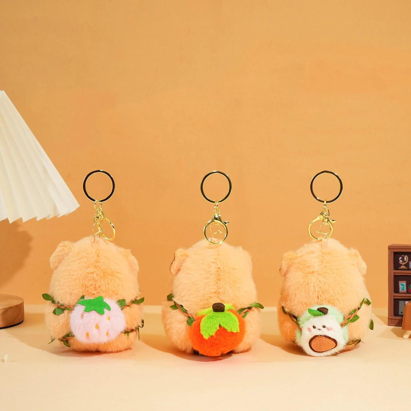 Cartoon Fluffy Orange Peach Fruit Backpack Hamster Animal Key Chain Cute Green Leaf Backpack Strap Avocado Capybara Doll Keyring