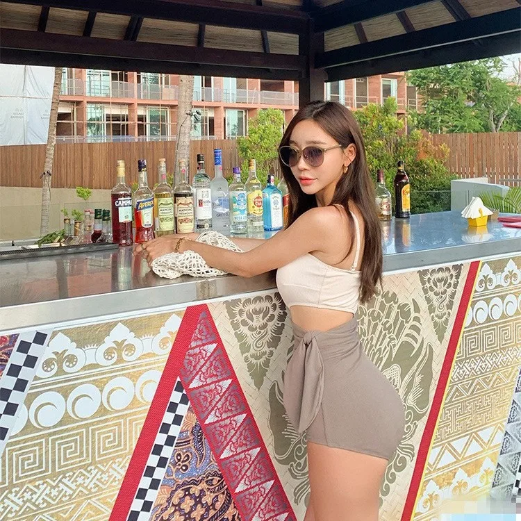 2025 South Korean hot spring irregular exposed waist tied knot contrasting color blocking sexy one-piece swimsuit for women