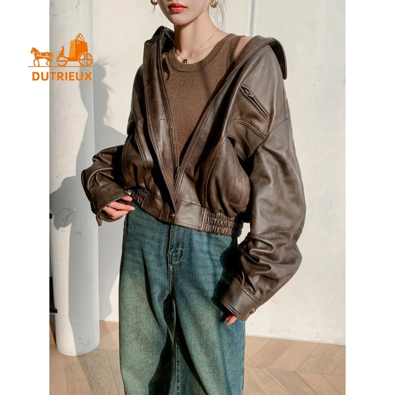 Nieuwe winter dames bruine losse korte leren jas, 100% echte schapenvacht, mode elegante motorfiets leren jas dames
