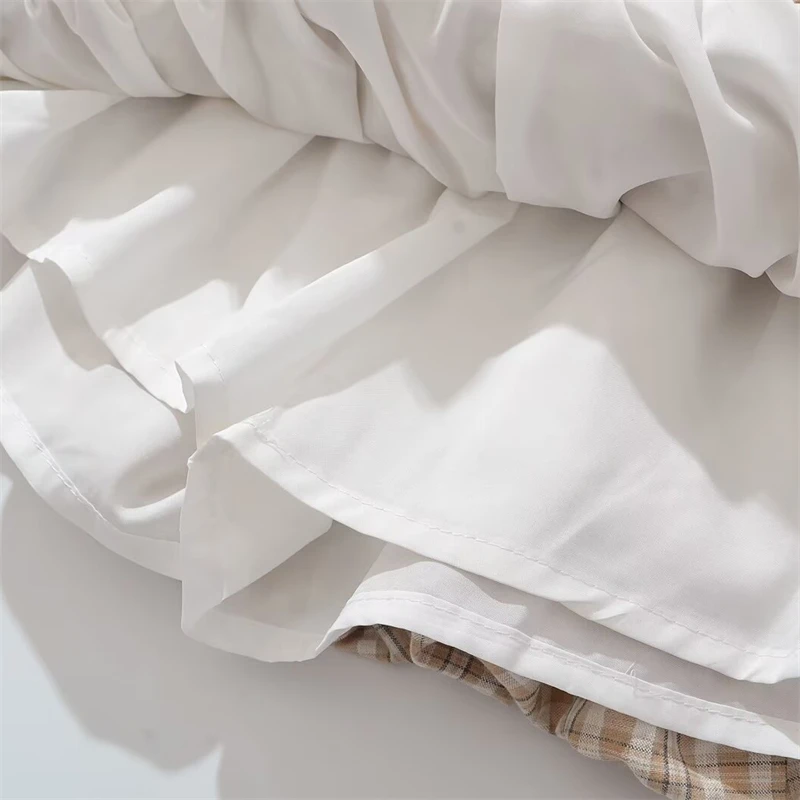 KEYANKETIAN 2025 Letnia nowa damska mini spódniczka w kratę w stylu preppy z kokardką i elastyczną talią A Line Puffy Skirt Fashion Pantskirt