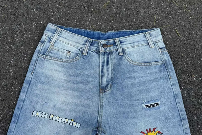 เย็บปักถักร้อยการรับรู้ปลอมเพชรการ์ตูน Graffiti กางเกงยีนส์ผู้ชายผู้หญิงคุณภาพสูง Hip Hop เสียหลวมตรงกางเกงยีนส์