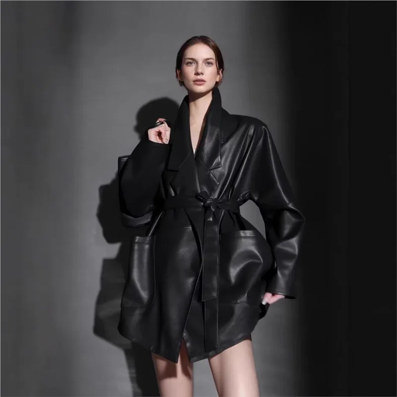 

A new mid-length leather with cinched-waist suit style for women featuring windbreaker feel