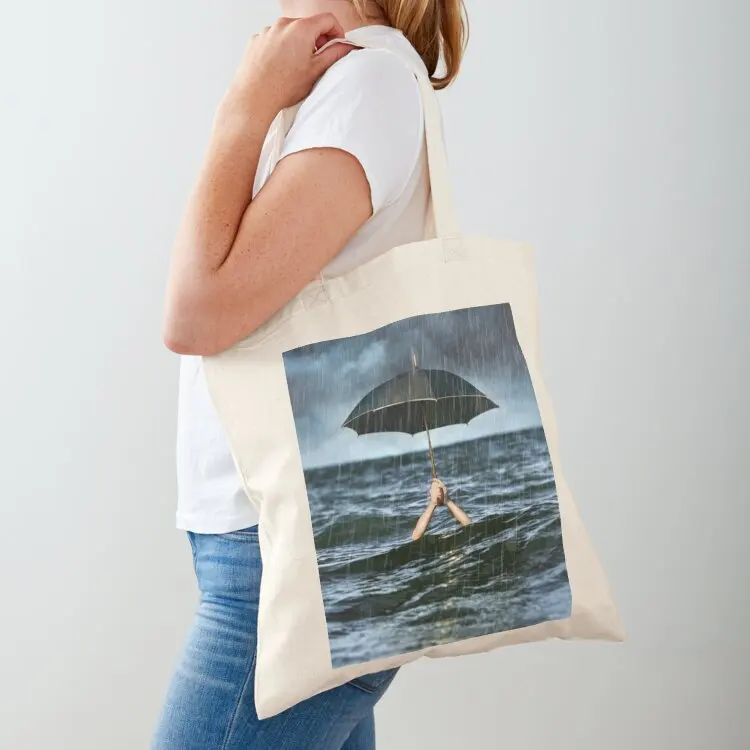 

Rain holding black umbrella in ocean underwater Tote Bag reusable grocery bags Women's handbag canvas tote bag