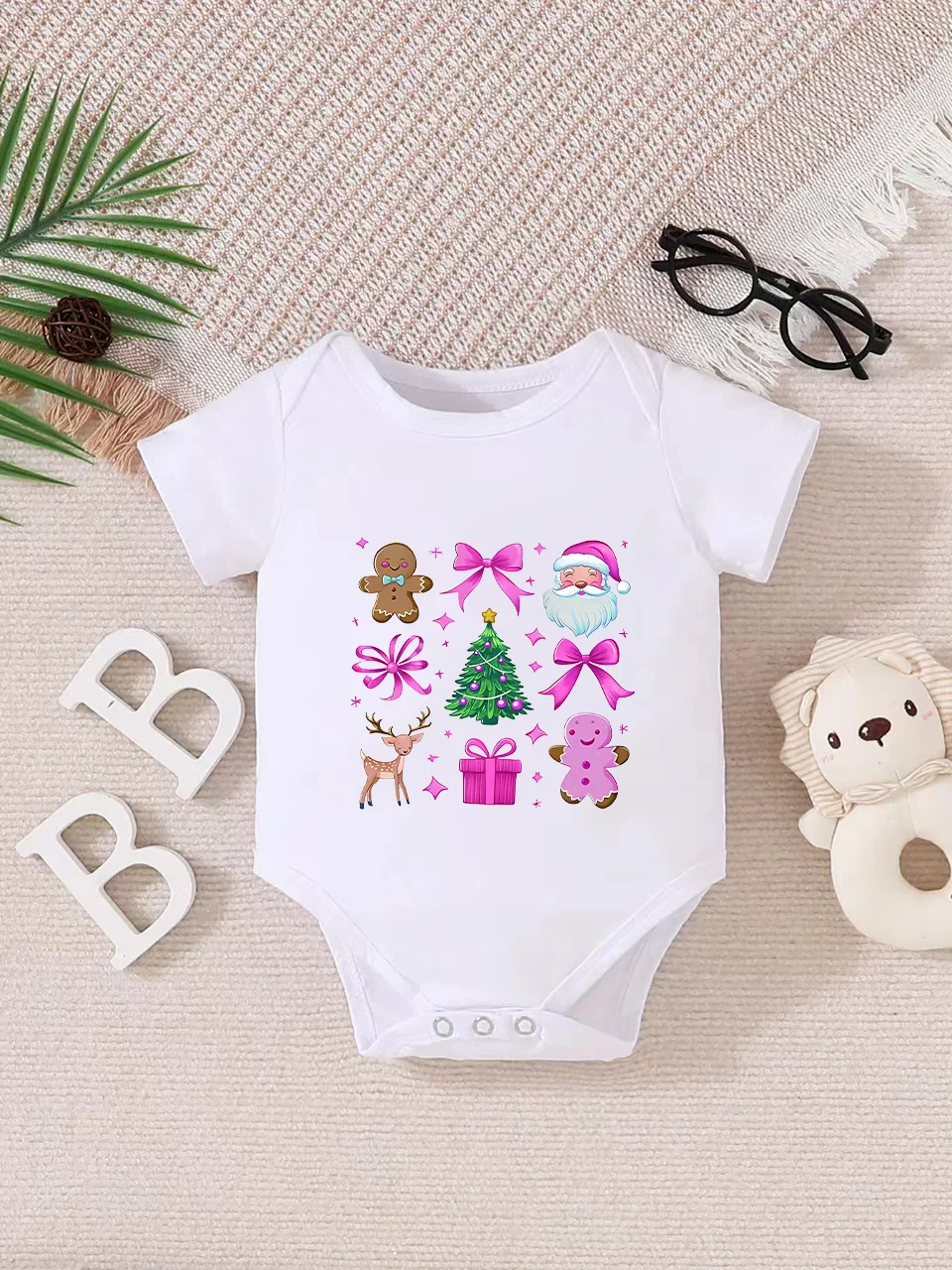 Playful letter-printed baby short-sleeve triangle bodysuit. Button closure for easy dressing, machine washable