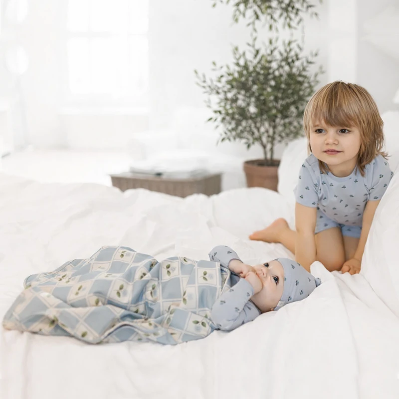 Ali Layette SS26 Printed Flowers Family Set Matches Coat Rompers Pink and Blue flowered blanket and Bib