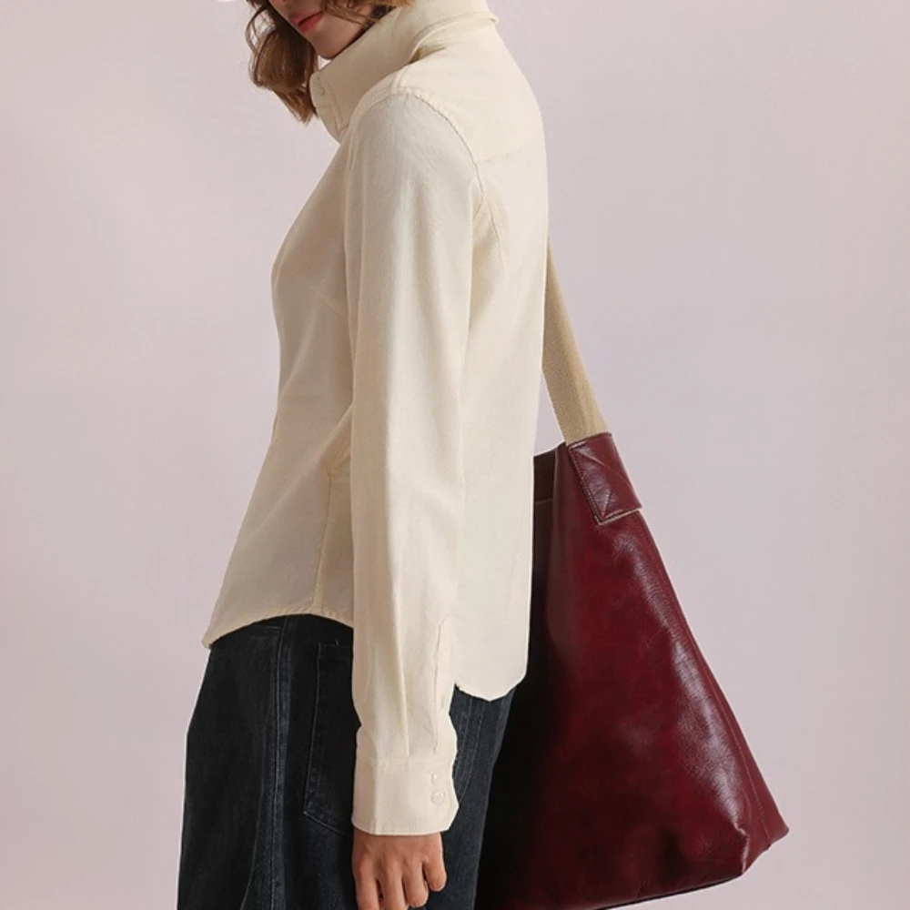 TWOTWINSTYLE Solid Spliced Knoppen Chic Shirt Vrouwelijke Revers Lange Mouw Losse Vintage Casual vrouwen Shirts Herfst Mode Nieuwe