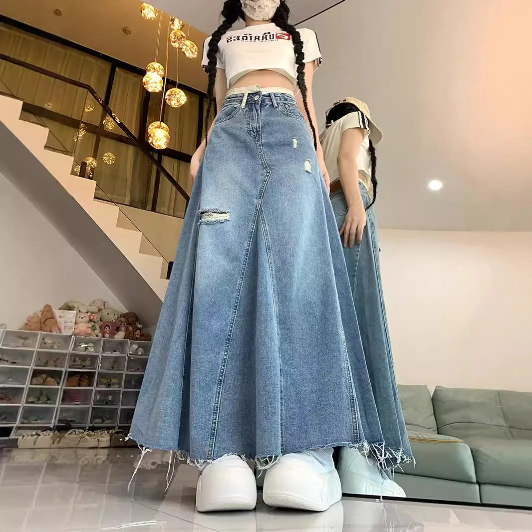 

Retro hole denim skirt female autumn and winter plus size loose fashion high waist slim long A word hip fishtail skirt.