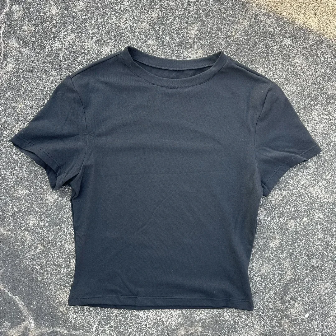 Damska koszulka do jogi z krótkim rękawem, oddychająca, w jednolitym kolorze, do treningu fitness, obcisła, z odkrytym pępkiem.