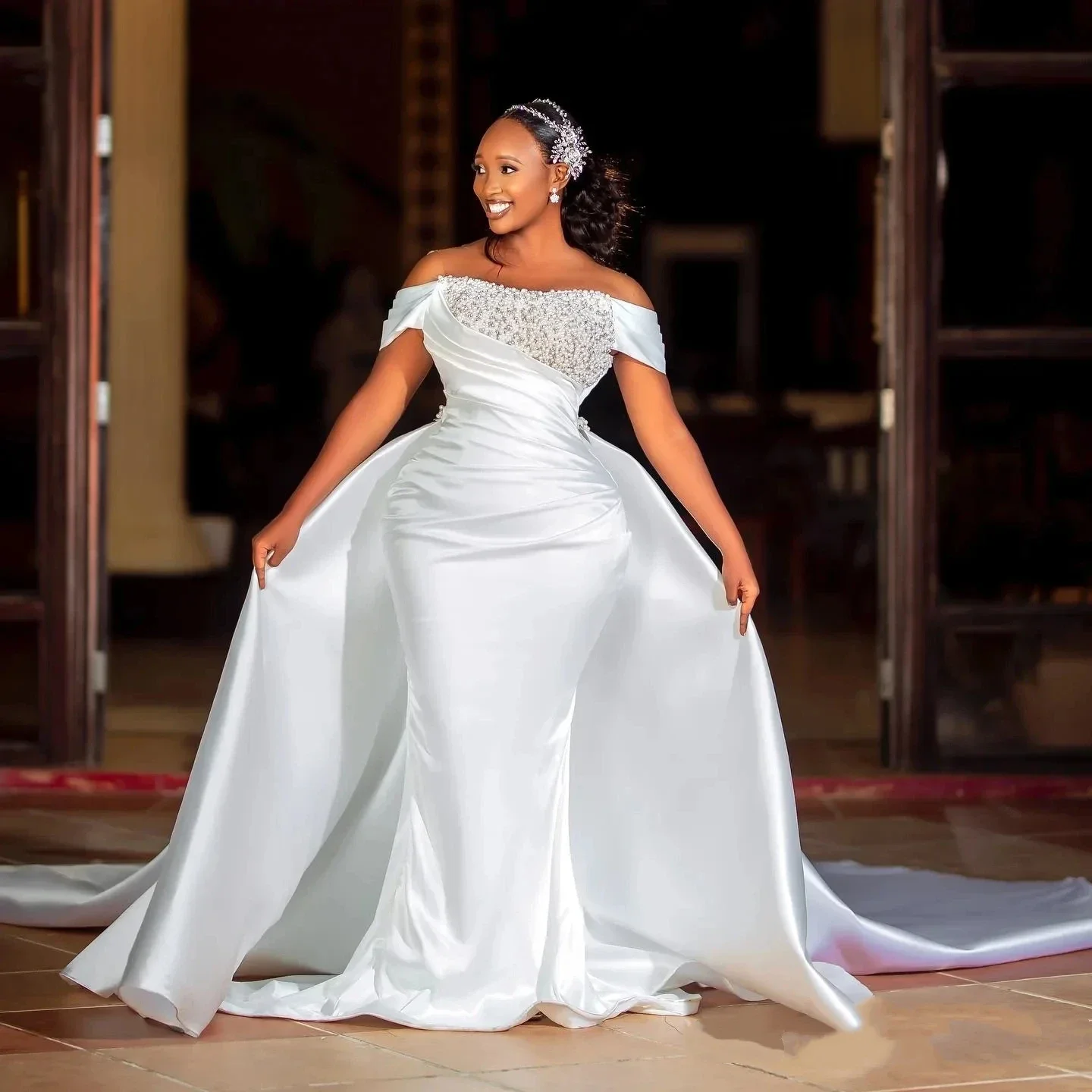 

Customized Shinny Pearls Wedding Dress with Detachable Train Off the Shoulder Satin Pleated African Corset Back Bridal Gowns