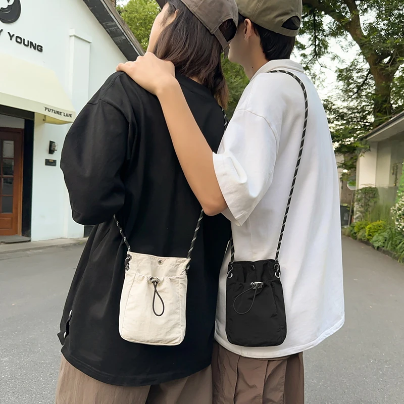 

Korean Mini Nylon Shoulder Bag For Men Women Chic Crossbody Bucket Bag Casual Drawstring Buckle Purse Small Handbag Phone Pouch