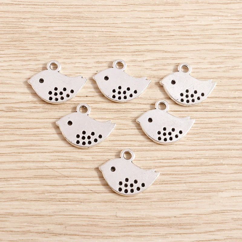 

Tusember 50Pcs Silver colors Alloy Pigeon Pendant Metal Dove Charms for Jewelry Making DIY Necklaces Earrings Handmade Craft