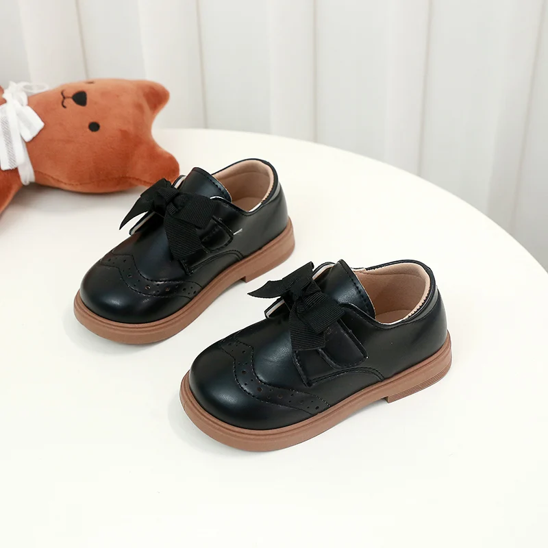 สาวรองเท้าหนังหวาน Bows เด็กเจ้าหญิงรองเท้า Retro สไตล์อังกฤษ 2025 เด็กใหม่แบนรองเท้า Soild สีลื่น