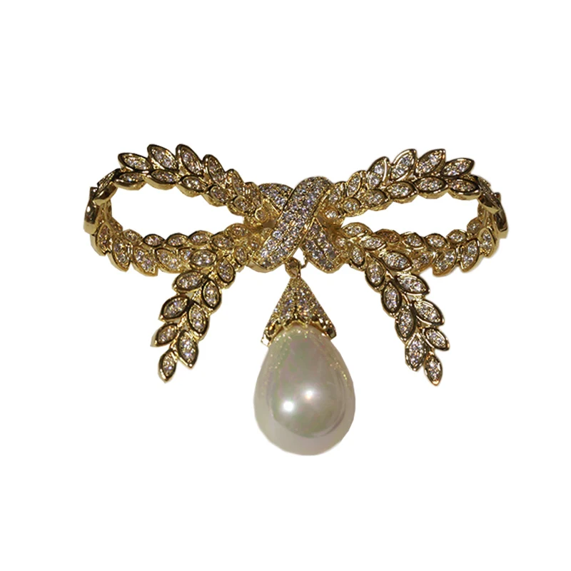 

Роскошный темперамент, большой бант, жемчужная брошь, золотой свитер, куртка, кардиган, корсаж, женские аксессуары Han Qiudong, элегантные