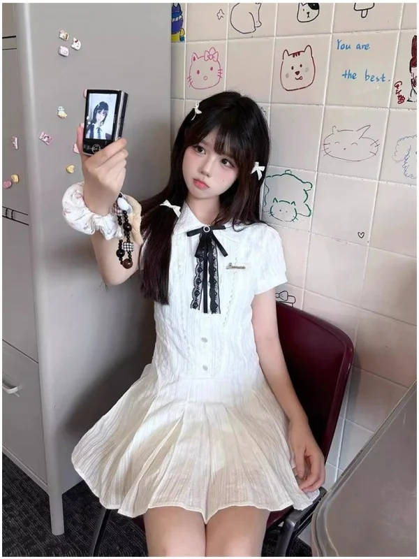 Letnia, słodka, herbaciana przerwa na herbatę, wyszczuplająca talia, kołnierzyk ort Dr, damska biała spódnica w kształcie litery A, pojedynczy element.