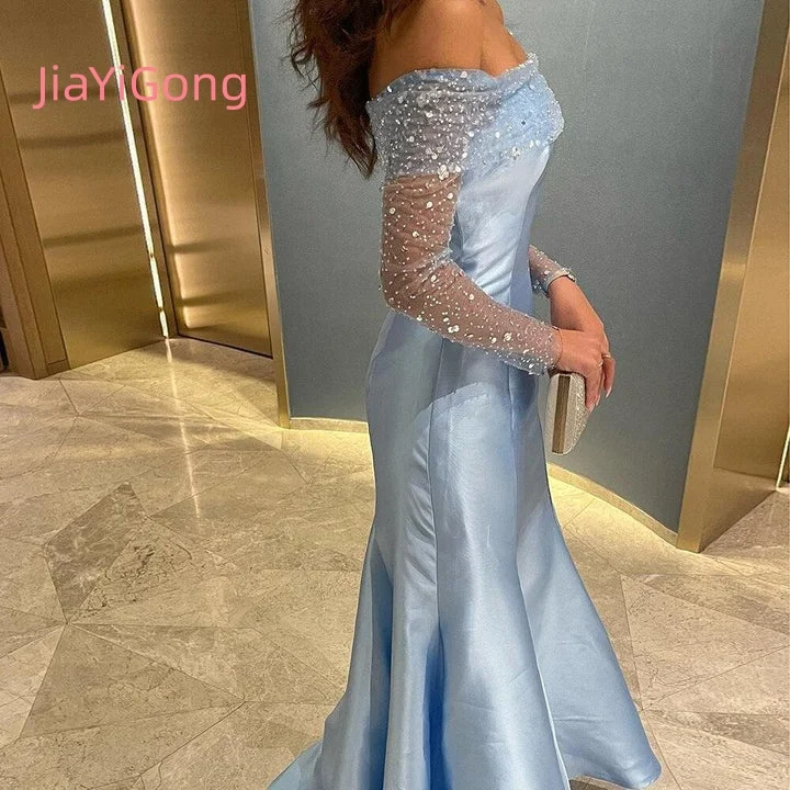 ชุดราตรีผู้หญิงสไตล์อาหรับสีฟ้าอ่อนแบบเปิดไหล่ ประดับเลื่อม แขนซีทรู รุ่น JiaYiGong 2026 รุ่น JE12811