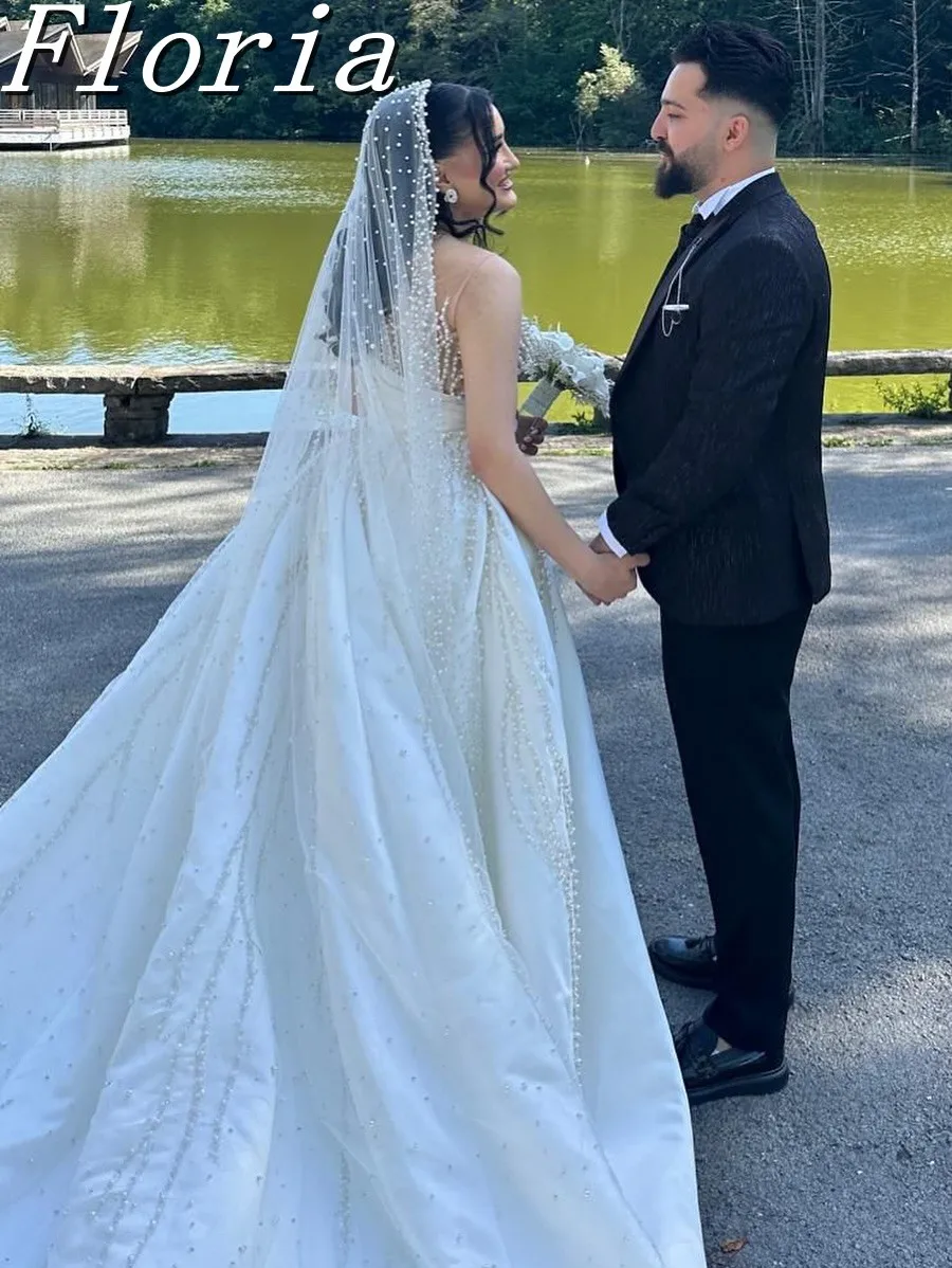 ชุดแต่งงานแบบมีลูกปัดมุกหรูหราสั่งทำพิเศษ แขนยาว พร้อมกระโปรงแบบถอดได้