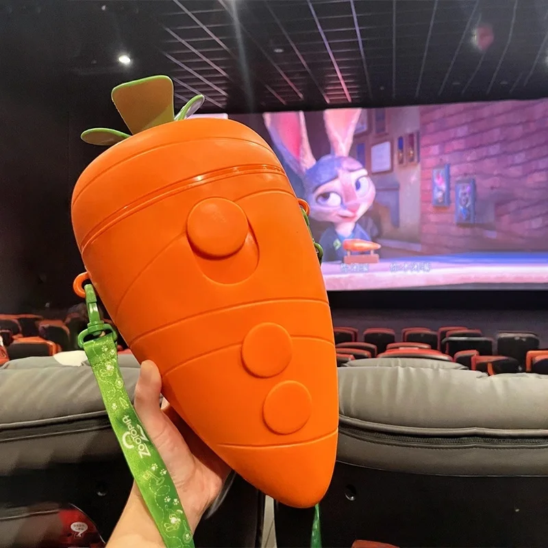 

Official Genuine Anime Zootopia 2 Peripheral Orange Carrot Shaped Popcorn Bucket With Green Leaf Strap Toy Gift