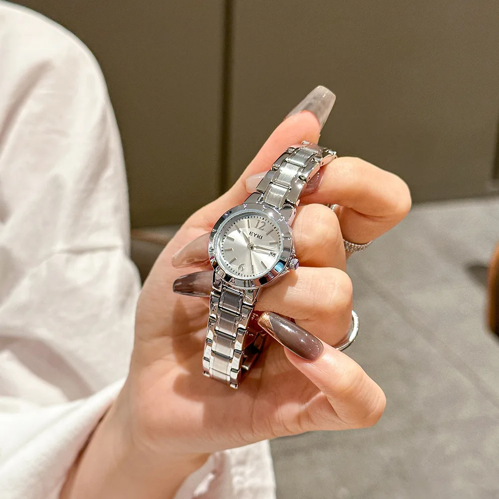 New stylish and elegant women's wristwatch with date display, featuring a stainless steel strap and quartz movement.