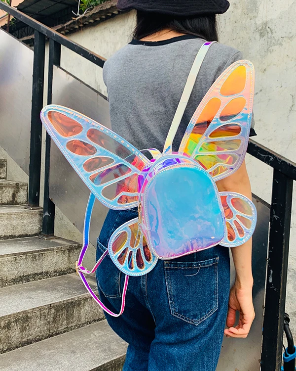 justice girls mini butterfly wing backpack ENJOININ Women's Laser Holographic Angel Wings Casual Daypack Shoulder Bag (Laser Light Blue) Polyurethane Sturdy top handle Adjustable shoulder straps Applique JUSTICE BUTTERFLY WINGS MINI BACKPACK