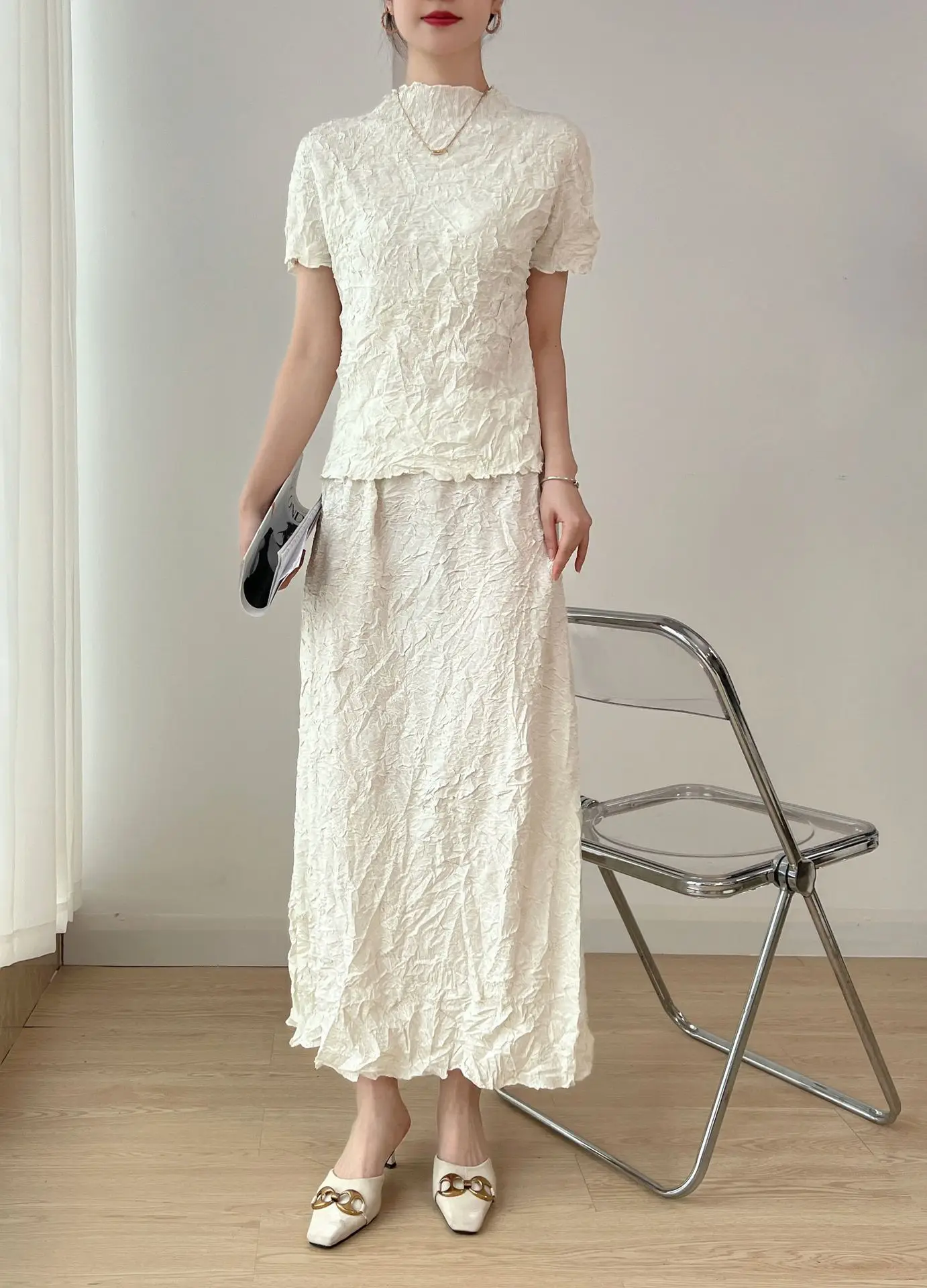 

Miyake Chic Beige Textured Pleated Women's Two Piece Set Stand Collar Short Sleeve T-shirt and Straight Midi Skirt Sets