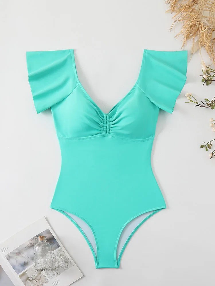 ชุดว่ายน้ำวันพีซผู้หญิง คอวี ผ้าจีบ ขอบระบาย โชว์หลัง กระชับหน้าท้อง ทรงไฮคัท สีพื้น