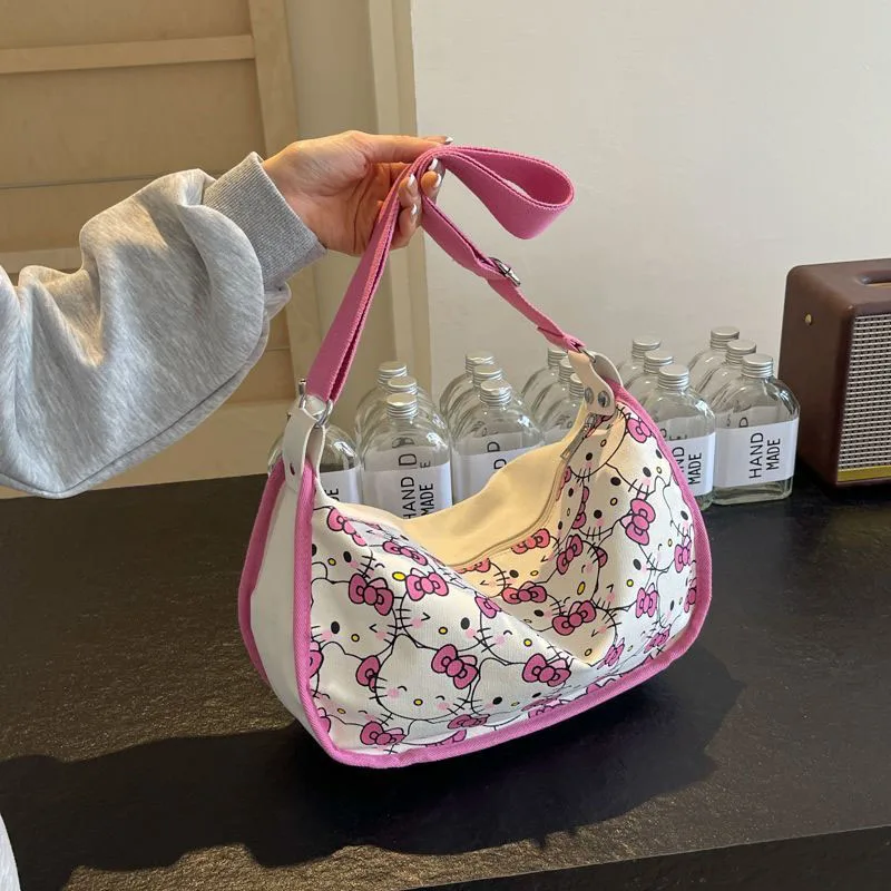 2024 New Sanrio Hello Kittys borsa di tela simpatico cartone animato stampa a schermo intero ragazza cuore Casual Versatile borsa a tracolla giocattoli regali per ragazza