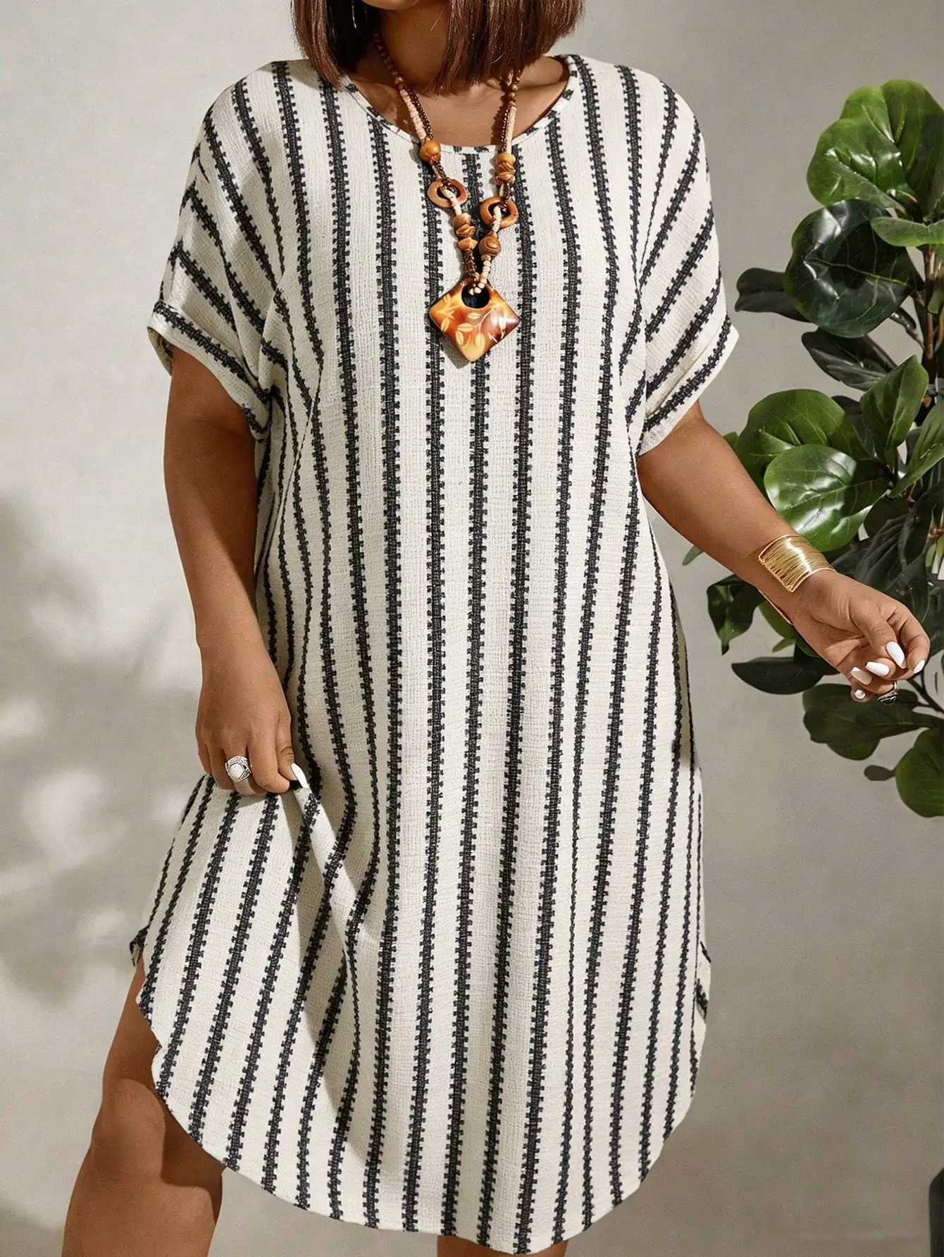 

Plus Size Women's Knit Jacquard Striped Short Sleeve Round Neck Casual Midi Dress With Curved Hem