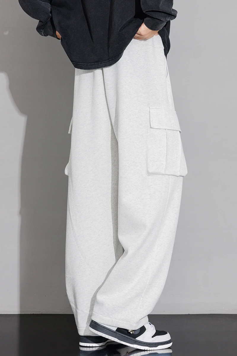 Męskie spodnie dresowe o prostym kroju, typu joggers, do sportu i streetwearu, luźne, oversize'owe, z długimi nogawkami, ze sznurkiem, męskie spodnie z wieloma kieszeniami.