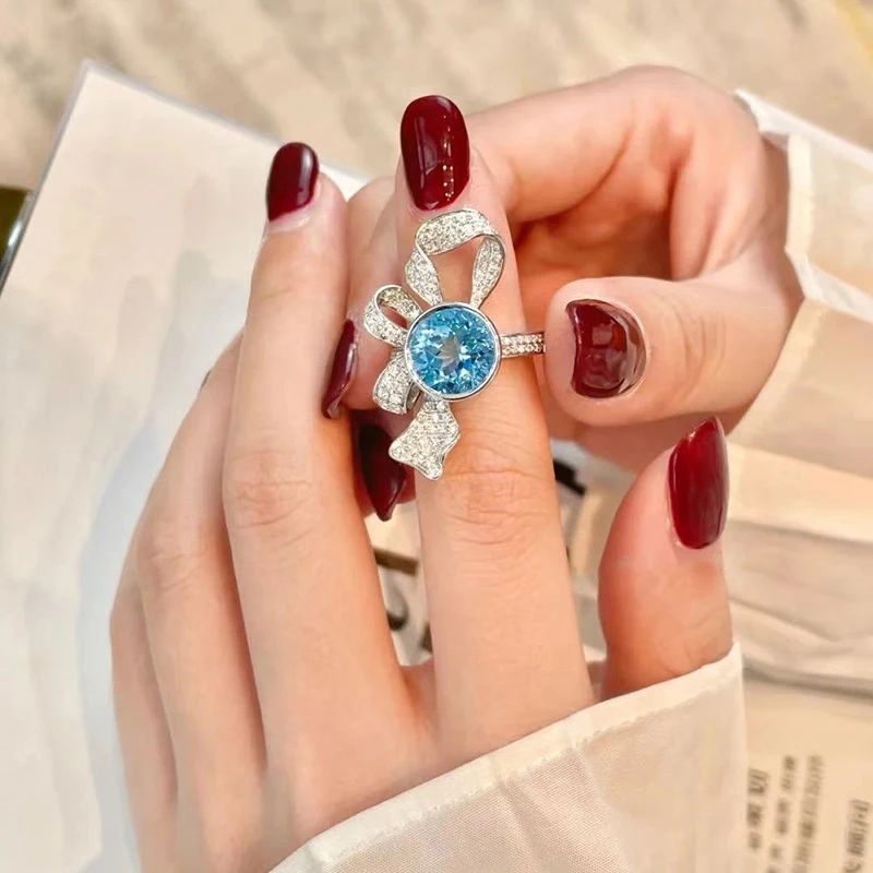 Romantic and creative sky blue gemstone winding flower rings for women inspiration diamond inlay bowknot ring wedding jewelry