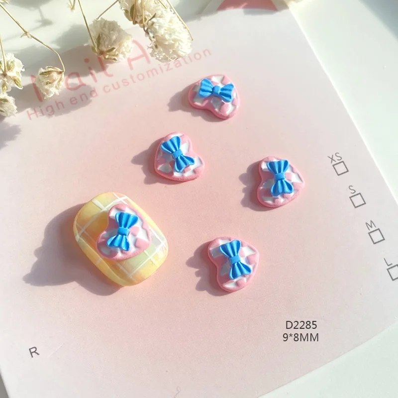 TSZS 10 ชิ้น/ล็อตที่มีสีสัน Kawaii Heart Bow Nail Art Charm เกาหลีญี่ปุ่น 3D น่ารักรักริบบิ้นเล็บตกแต่ง