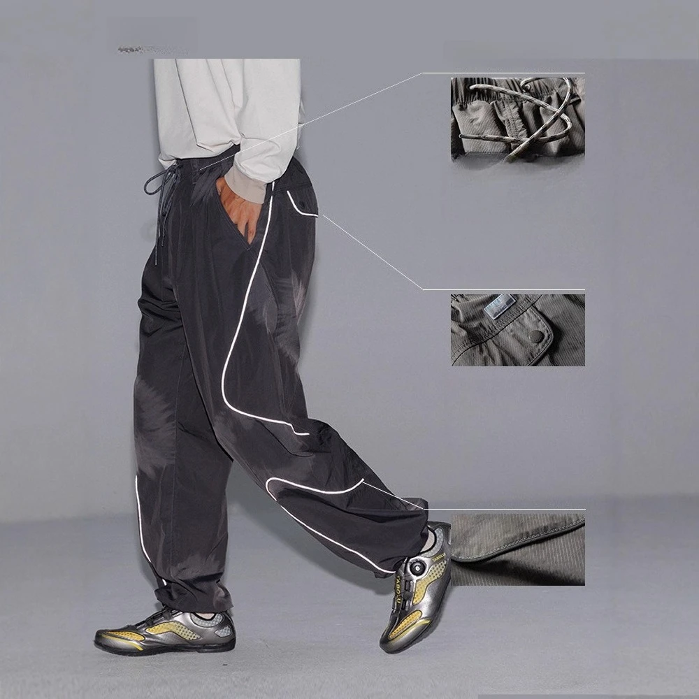 

Спортивные повседневные брюки в светоотражающую полоску для занятий спортом на открытом воздухе. Высококачественные мужские и женские уличные прямые брюки.