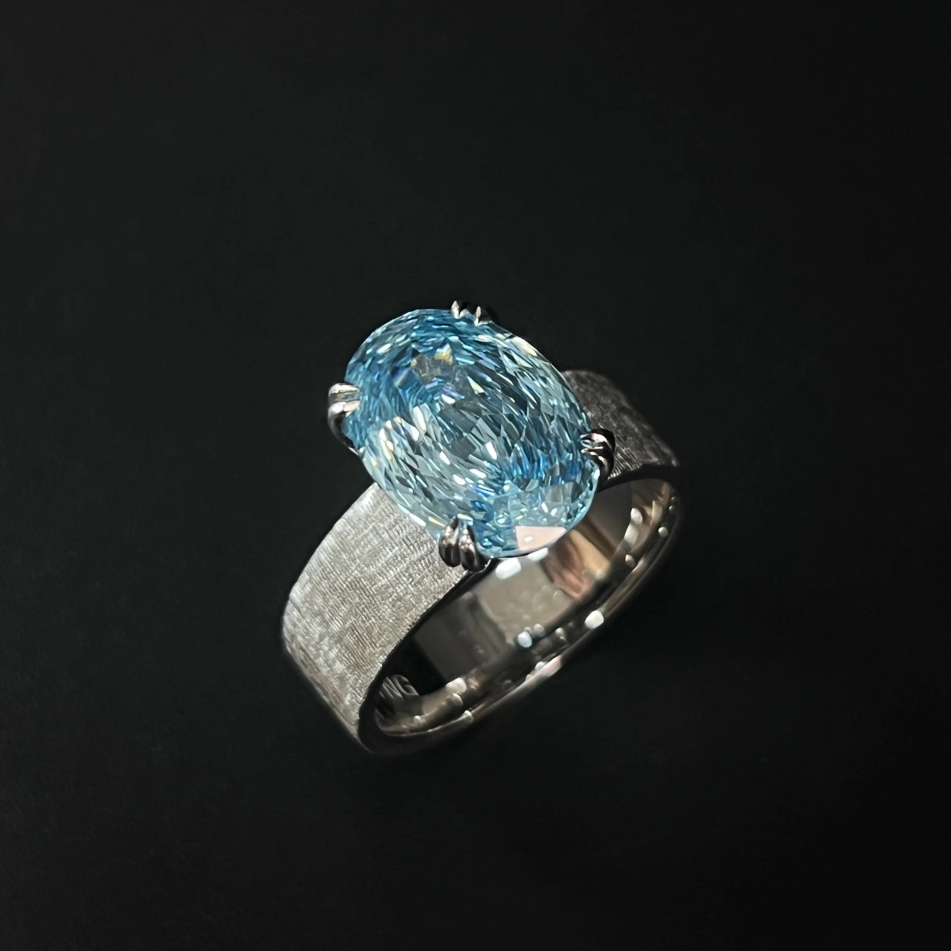 

S925 Silver Ocean Blue Topaz Paraíba Color Light Luxury Braided Wide-Armed Ring