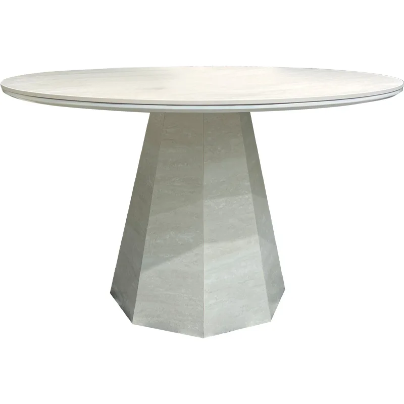 The new travertine rock slab dining table is simple, modern, high-end medieval and quiet wind small apartment round dining table