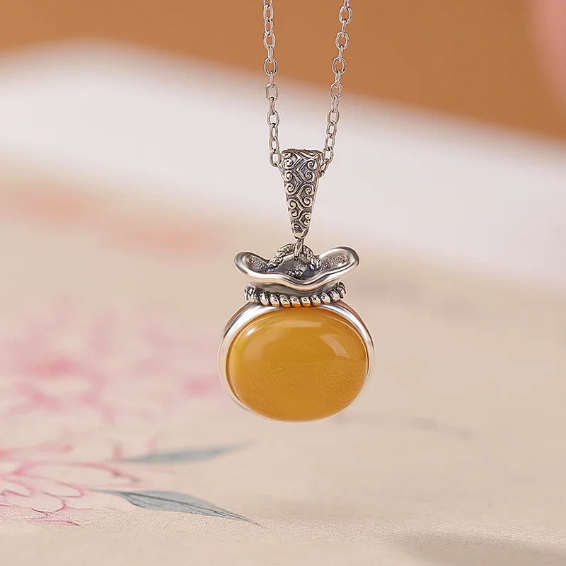 ciondolo-in-argento-con-superficie-portafortuna-zakiram-in-ambra-s925-sterling