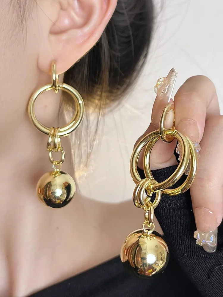 

Vintage Geometric Metal Circular Exaggerated Earrings For Ladies, Exuding Elegant Charm At The Earlobe.