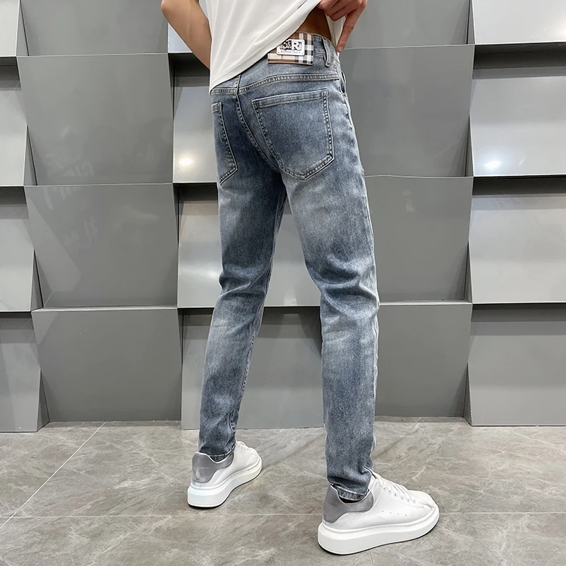 

Light luxury all-matching jeans men's street fashion simple casual elastic trend Korean high-end slim fit tapered pants