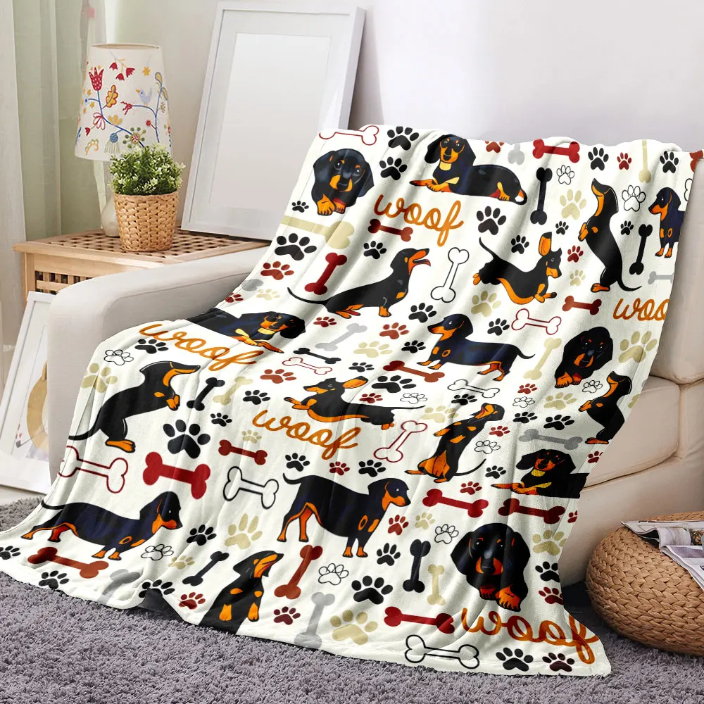 Manta con estampado de perro salchicha: diseño caprichoso de perro negro y tostado con estampados de patas, huesos y texto