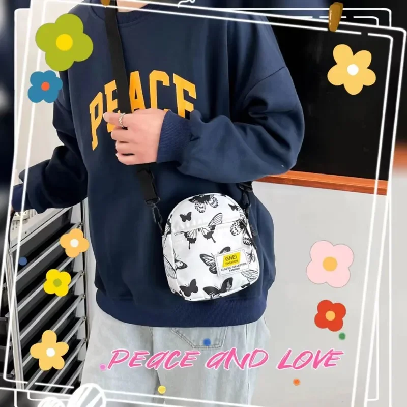 1 Stück Kinder Junge Mädchen Rucksack Mode amerikanischen Stil Schmetterling kleine Umhängetasche Mini tragbare Outdoor-Münze Ohrhörer Spielzeug Tasche