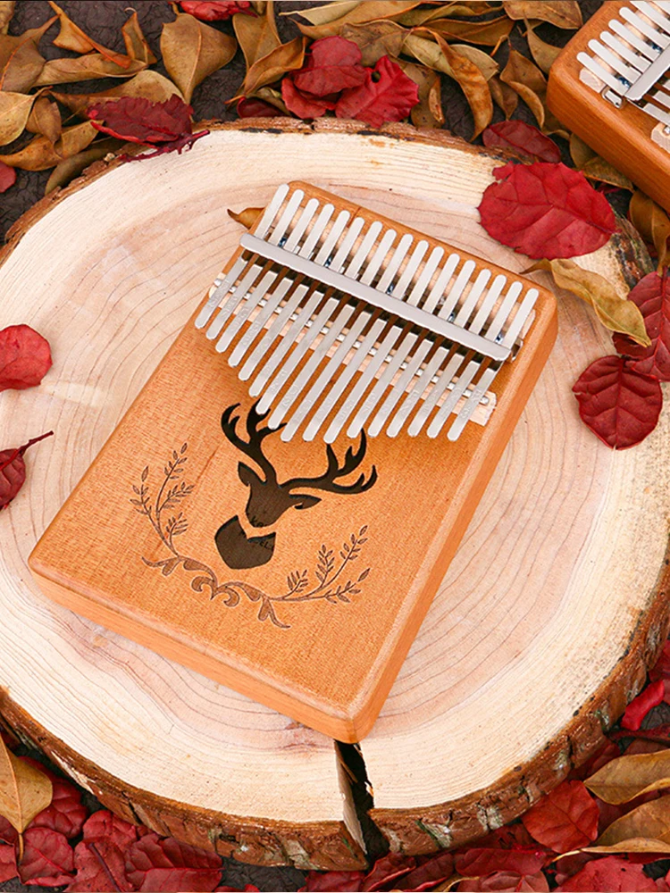 Kalimba beginner beginner easy to learn thumb piano finger piano portable 17 tone peach blossom core finger piano instrument