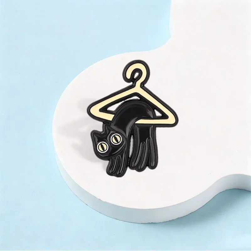 Cute Black Cat Hanging On The Hanger Enamel Pin Funny Liquid Cat Meme Metal Brooch Lapel Bag Badge Jewelry Gift for Kids Friends