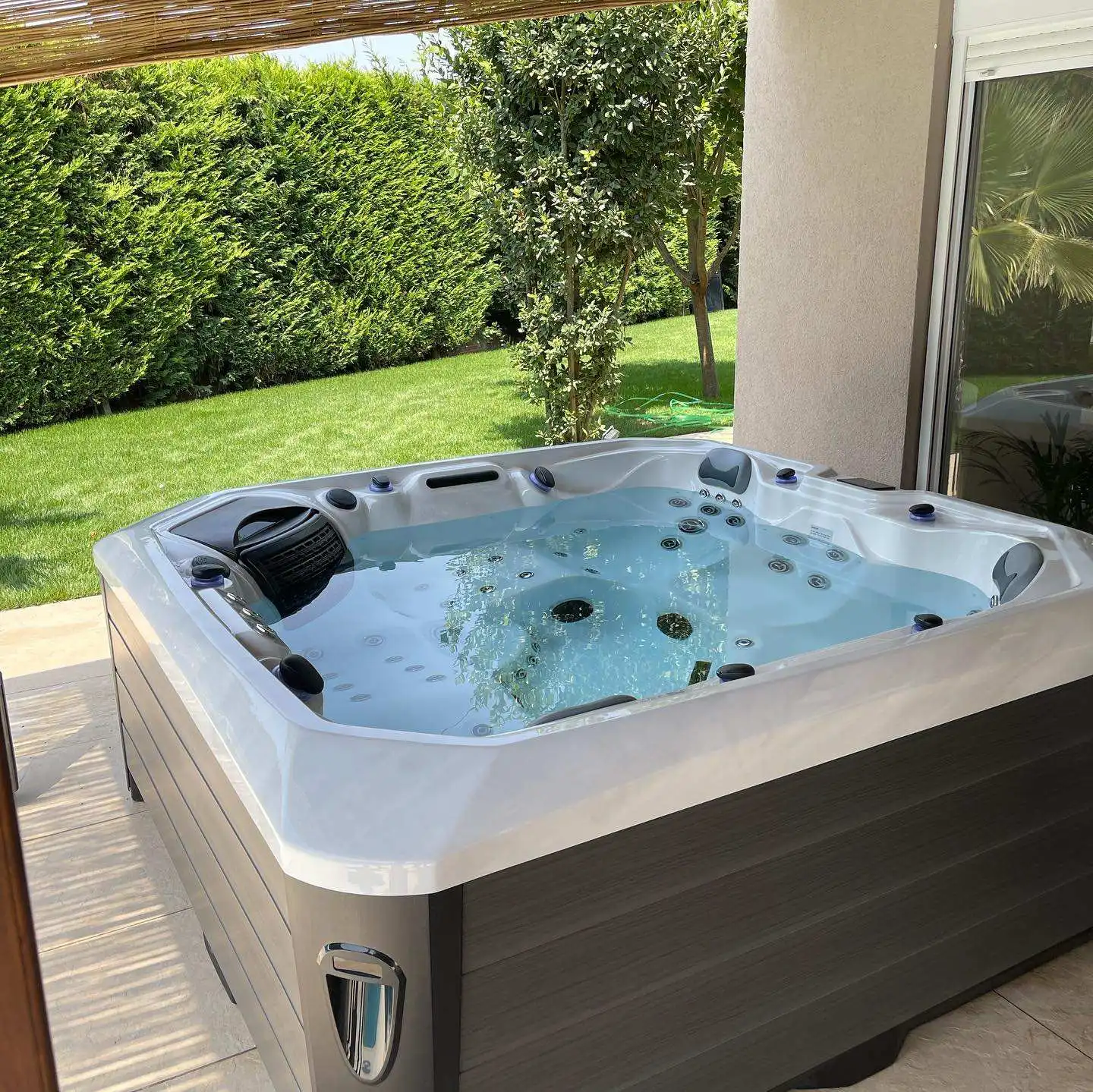 The Modern Garden Features a Freestanding Acrylic Hot Tub That Seats Five and Is Equipped with 61 Massage Jets.