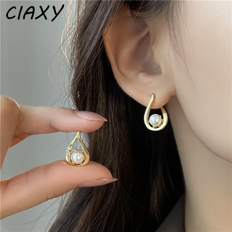 2023 New Hollow Simulated Pearl Pendant Dangle Earrings for Women Simple Spiral Drop Korean Fashion Ear Buckle Luxury Jewelry