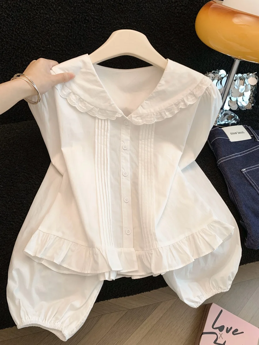 

White Doll Collar Long Sve irt Women's Spring 2026 New High-End Age-Defng Faionable Lace Hem Blouse French Sle