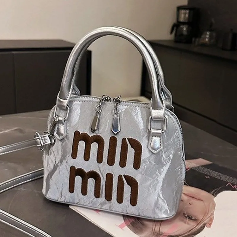

Female Versatile Handbag Adaptable For Multiple Occasions From Office To Evening Seamless Transition