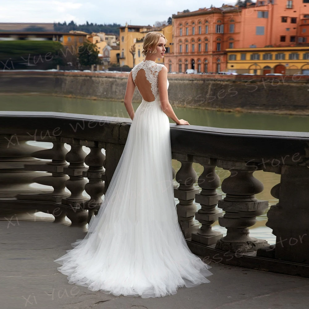 Generoso O collo una linea abiti da sposa da donna affascinanti Appliques di pizzo abiti da sposa classici senza maniche Backless Vestido De Noivas