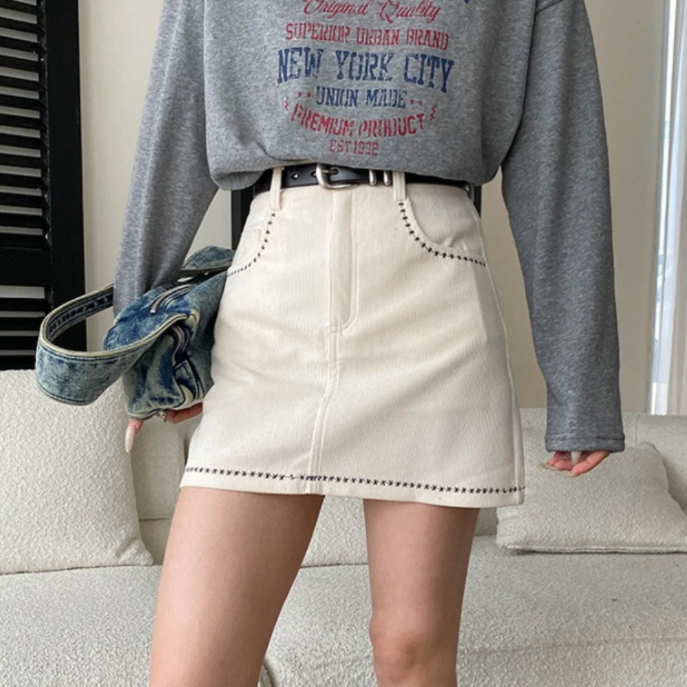 TWOTWINSTYLE Solid Spliced Pocket Casual Skirt Female High Waist Slimming French Elegant Women's Short Skirts Autumn New Fashion