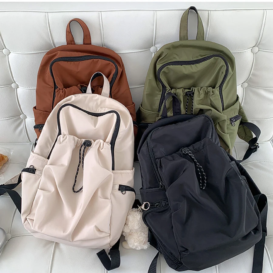 Mochila Coreana de gran capacidad para niñas, bolso de hombro plisado de nailon, mochila de viaje de color sólido, mochila negra