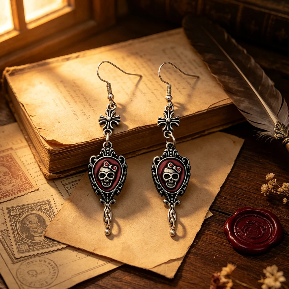 Halloween carved photo frame style long earrings, featuring an embedded bow and skull pattern, with red and black enamel, aged vintage silver texture, dark gothic style, suitable for everyday wear.