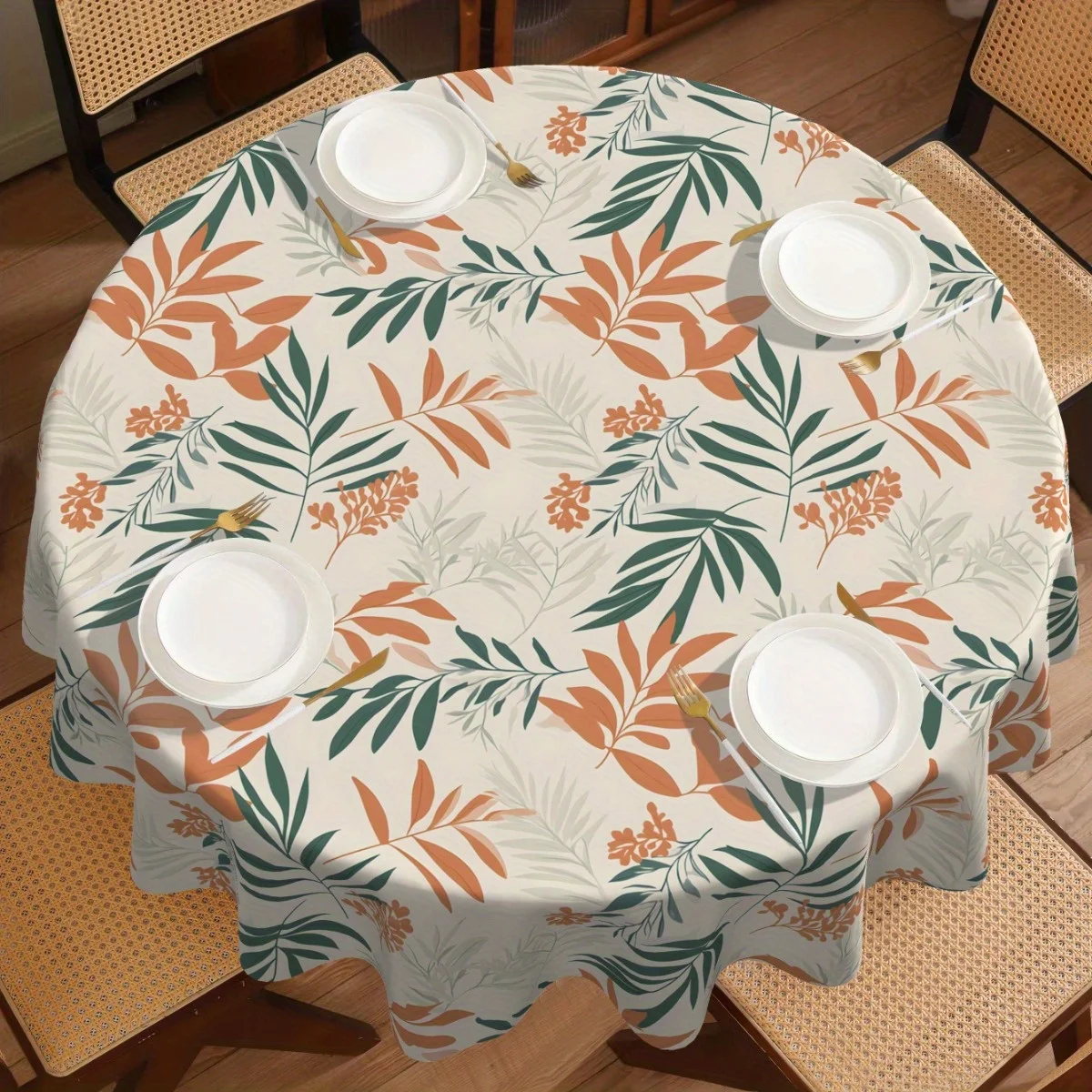 One round tablecloth, featuring a small leaf design, is made of water-washable nylon fabric.